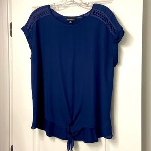 Spring sheer top ties at the waist.